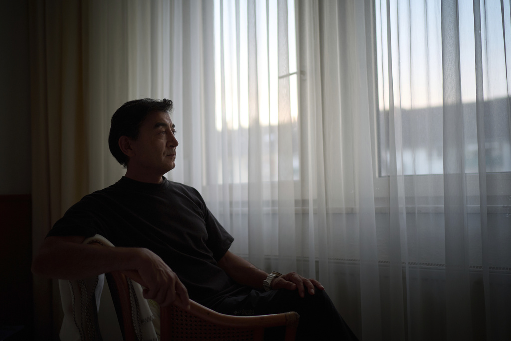 Former Xinjiang government engineer Nureli Abliz, who saw firsthand how surveillance technology flagged thousands of people in China for detention, even when they had committed no crime, sits for a portrait in Mannheim, Germany, where he now lives in exile, Wednesday, July 23, 2025. (AP Photo/David Goldman)