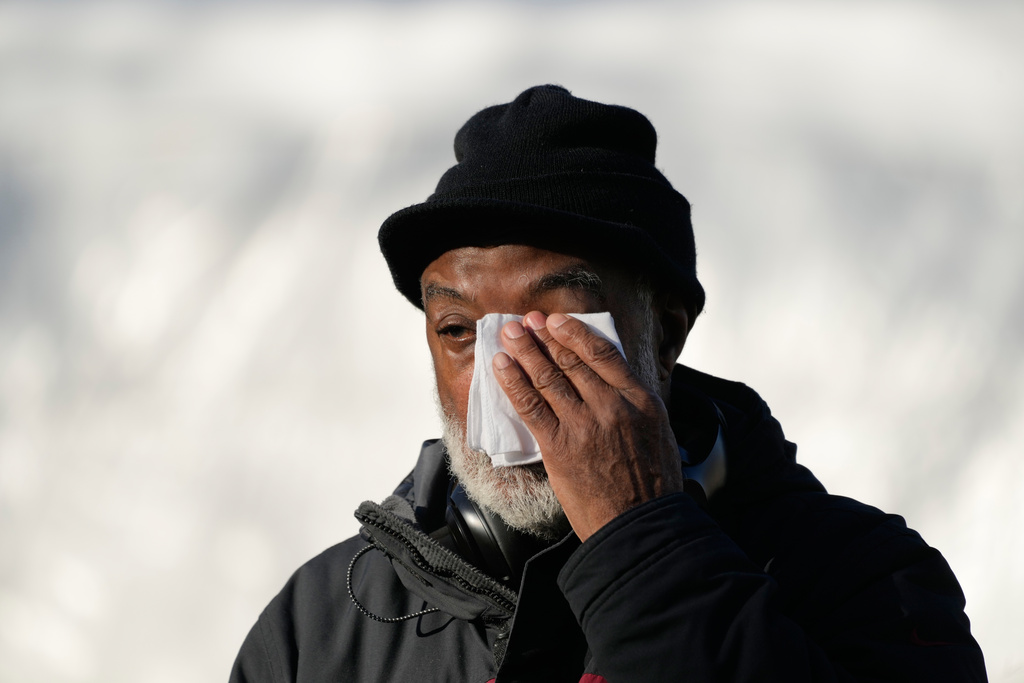 A man wipes his eyes before the public visitation for the Rev. Jesse Jackson at Rainbow PUSH Coalition headquarters in Chicago, Friday, Feb. 27, 2026. (AP Photo/Nam Y. Huh)