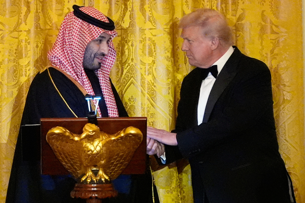 President Donald Trump shakes hands with Saudi Arabia's Crown Prince Mohammed bin Salman during a dinner in the East Room of the White House, Tuesday, Nov. 18, 2025, in Washington. (AP Photo/Alex Brandon)
