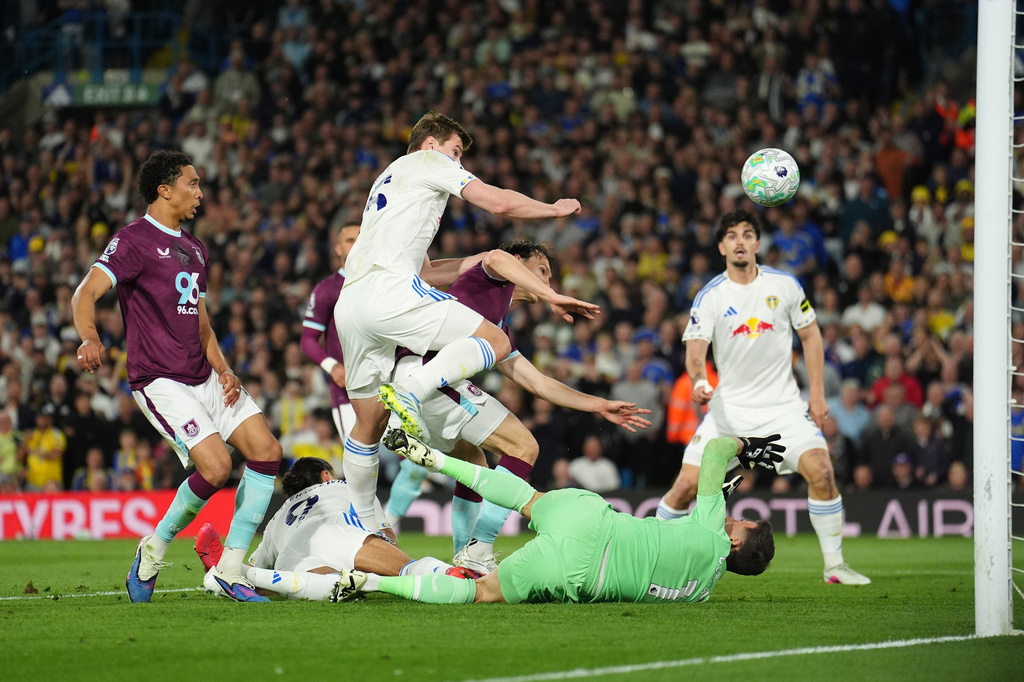 Leeds United's Dominic Calvert-Lewin, second from left, scores their side's third goal during the Premier League match between Leeds United and Burnley, in Leeds, England, Friday, May 1, 2026. (Martin Rickett/PA via AP)