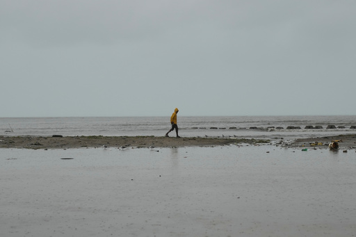 A man walks along the coastline ahead of the forecasted arrival of Hurricane Melissa in Old Harbour, Jamaica, Monday, Oct. 27, 2025. (AP Photo/Matias Delacroix) A man walks along the coastline ahead of the forecasted arrival of Hurricane Melissa in Old Harbour, Jamaica, Monday, Oct. 27, 2025. (AP Photo/Matias Delacroix)