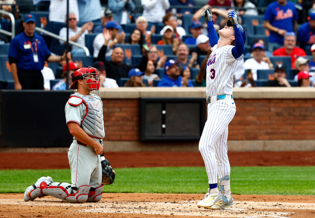New York Mets' Carson Benge, right, reacts after hitting a home run against the Philadelphia Phillies during the second inning of a baseball game, Saturday, Sept. 19, 2026, in New York. (AP Photo/Noah K. Murray)