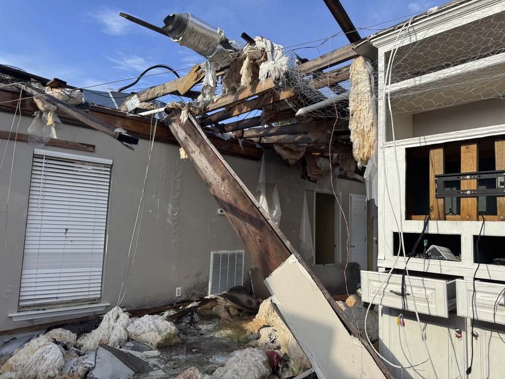 The wreckage of Buddy Anthony's home stands exposed to the elements on Thursday, Aug. 14, 2025, in Tylertown, Miss. (AP Photo/Sophie Bates)