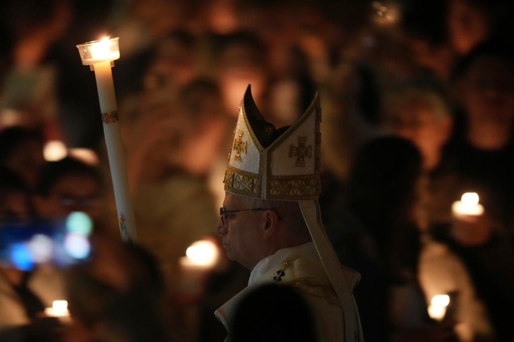Pope Leo XIV arrives for the Easter Vigil inside St. Peter's Basilica at The Vatican, Saturday, April 4, 2026. (AP Photo/Andrew Medichini)
