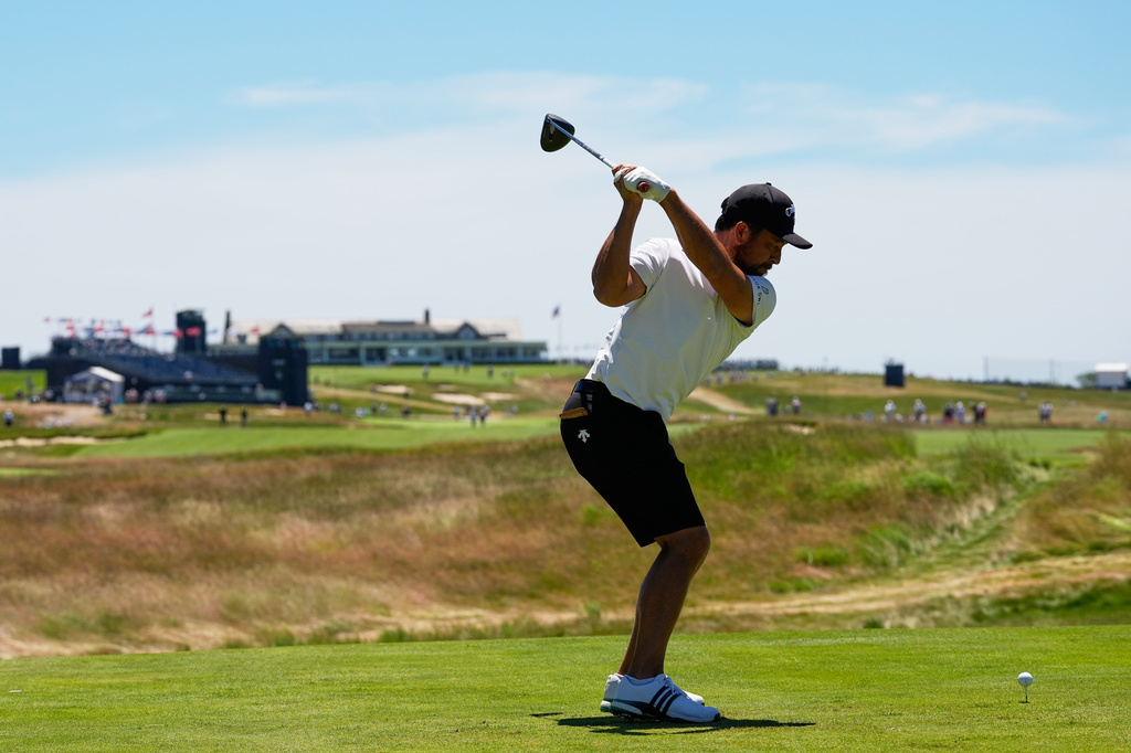 Xander Schauffele hits his tee shot on the 16th hole during a practice round for the U.S. Open golf tournament at Shinnecock Hills Golf Club in Southampton, N.Y., Tuesday, June 16, 2026.(AP Photo/David J. Phillip)