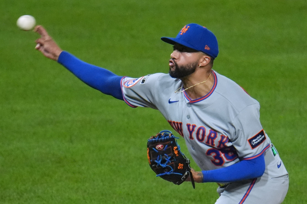 FILE - New York Mets pitcher Devin Williams delivers during the ninth inning of a baseball game against the Pittsburgh Pirates in Pittsburgh, on Aug. 7, 2026. (AP Photo/Gene J. Puskar, File)
