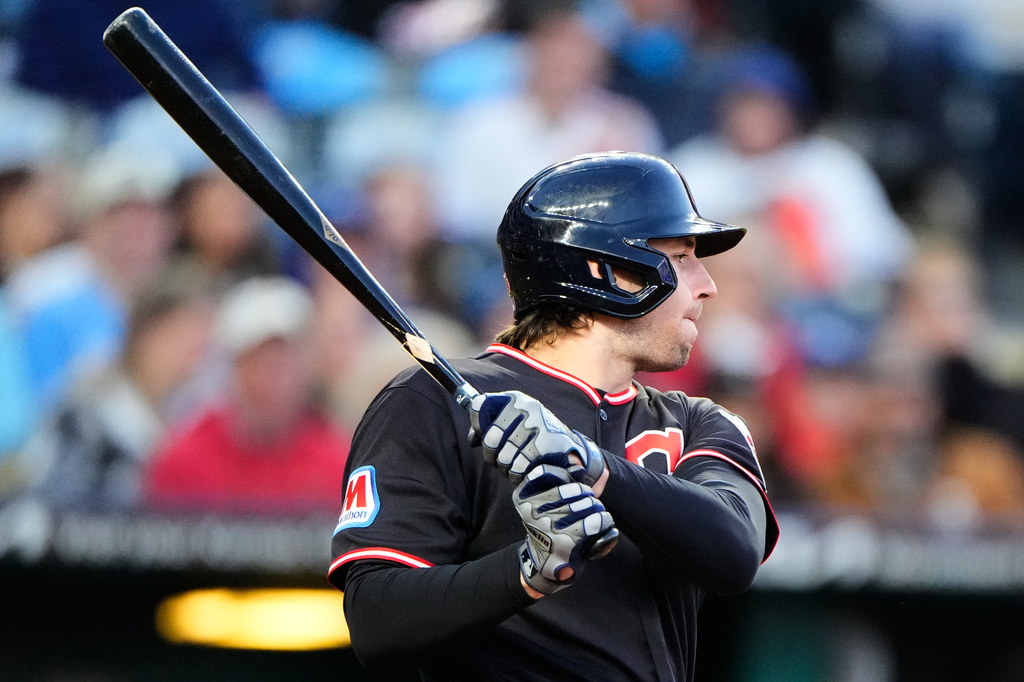 Cleveland Guardians' Chase DeLauter watches his two-run single during the fifth inning of a baseball game against the Kansas City Royals, Wednesday, May 6, 2026, in Kansas City, Mo. (AP Photo/Charlie Riedel)