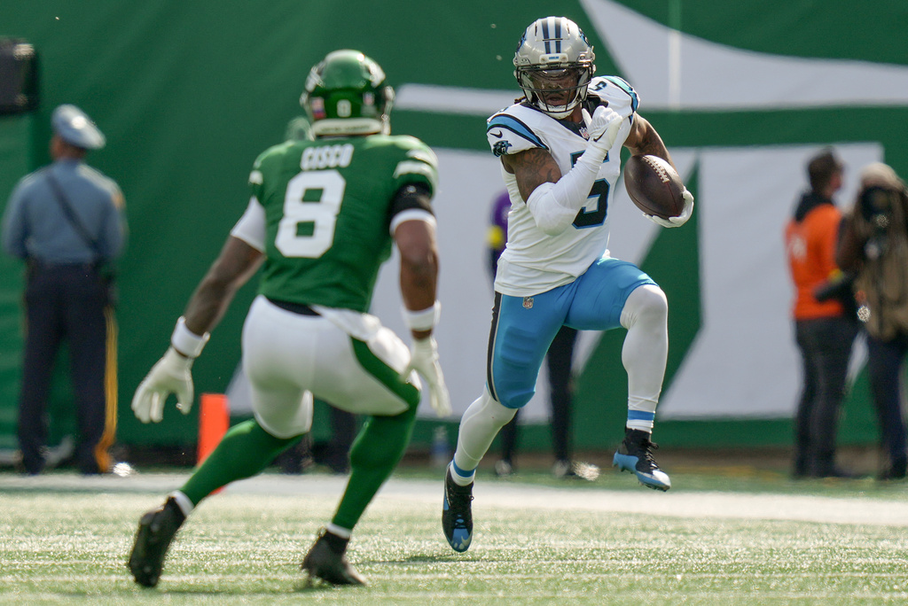 Carolina Panthers running back Rico Dowdle (5) carries the ball against the New York Jets during the second quarter of an NFL football game, Sunday, Oct. 19, 2025, in East Rutherford, N.J. (AP Photo/Angelina Katsanis)