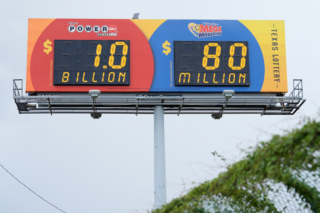 A billboard displays the estimated Powerball jackpot in Houston, Tuesday, Aug. 11, 2026. (AP Photo/Ashley Landis)