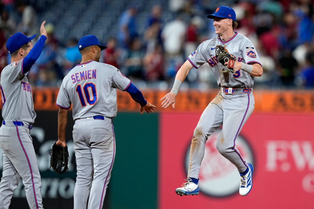 New York Mets' Carson Benge, right, celebrates with Marcus Semien after the Mets won a baseball game against the Philadelphia Phillies Thursday, June 18, 2026, in Philadelphia. (AP Photo/Matt Slocum)