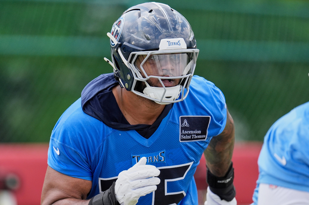 FILE - Tennessee Titans offensive tackle Dan Moore Jr. (75) runs through a drill during an NFL football practice Tuesday, June 3, 2025, in Nashville, Tenn. (AP Photo/George Walker IV, File)