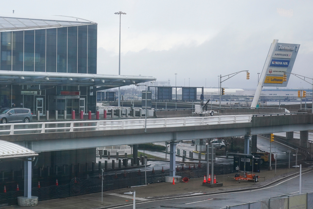 FILE - A vehicle stops at Terminal 1 at John F. Kennedy International Airport in New York, Feb. 17, 2023. (AP Photo/Seth Wenig, File)