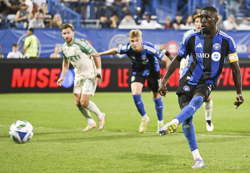 CF Montreal's Prince Owusu, right, scores from the penalty spot during second-half MLS soccer match action against Austin FC in Montreal, Saturday, Aug. 23, 2025. (Graham Hughes/The Canadian Press via AP)