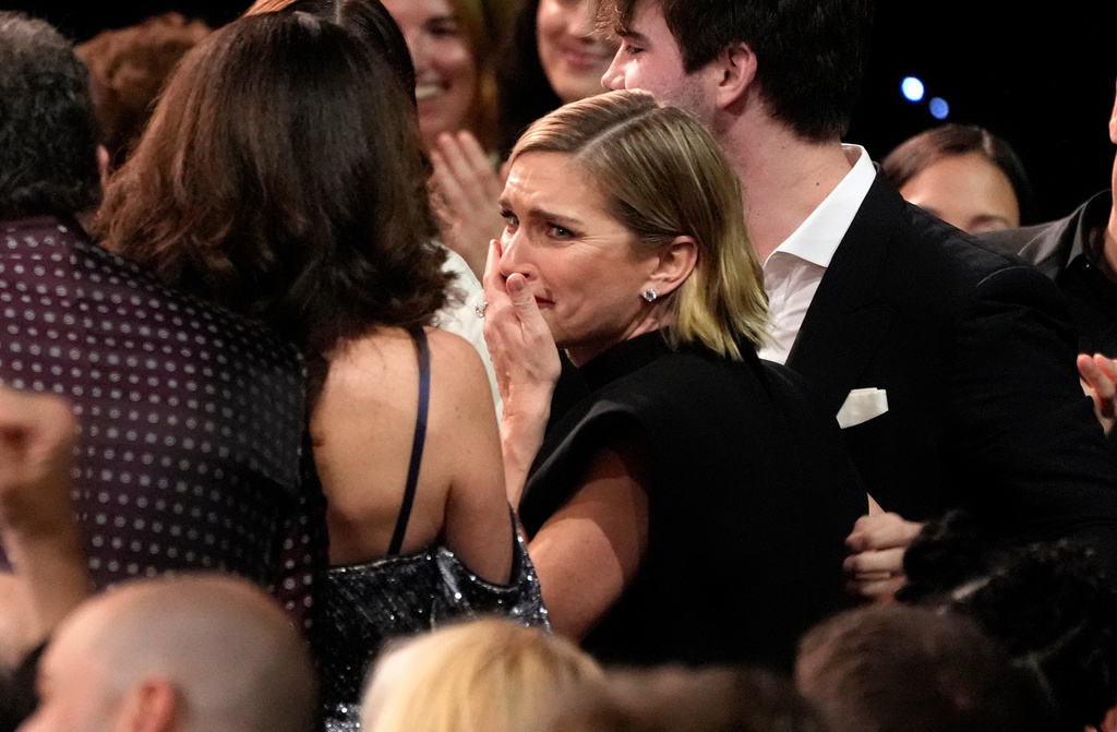Rhea Seehorn, center, reacts to winning the award for best actress in a drama series for "Pluribus" during the 31st Annual Critics Choice Awards on Sunday, Jan. 4, 2026, at The Barker Hanger in Santa Monica, Calif. (AP Photo/Chris Pizzello)