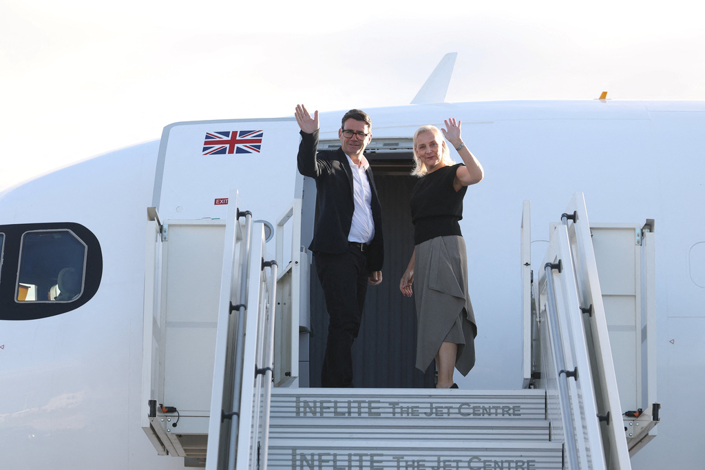 Britain's Prime Minister Andy Burnham and his wife Marie-France van Heel board a plane for the United States, at Stansted Airport, Stansted, England, Monday Sept. 21, 2026, to attend the UN General Assembly in New York. (Toby Melville/Pool Photo via AP)