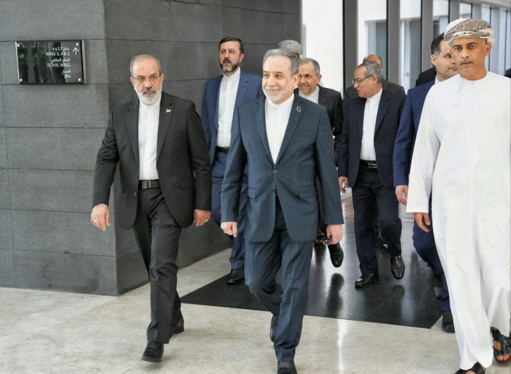 In this photo released by the Iranian Foreign Ministry, Iranian Foreign Minister Abbas Araghchi, center, heads to venue for talks between Iran and the U.S., in Muscat, Oman, Friday, Feb. 6, 2026. (Iranian Foreign Ministry via AP)