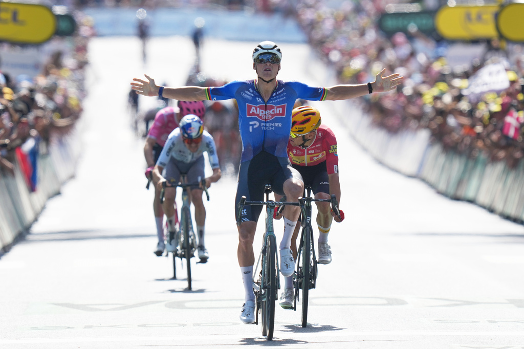 Netherland's Mathieu van der Poel crosses the finish line to win the ninth stage of the Tour de France cycling race with start in Malemort and finish in Ussel, France, Sunday, July 12, 2026. (AP Photo/Thibault Camus)
