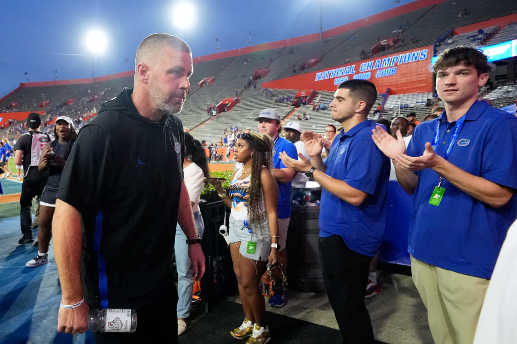 Florida head coach Billy Napier leaves the field after defeating Texas in an NCAA college football game, Saturday, Oct. 4, 2025, in Gainesville, Fla. (AP Photo/John Raoux)