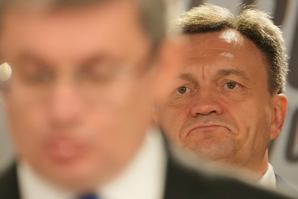 Moldova's Prime Minister Dorin Recean, right, listens to Igor Grosu, president of Moldova's parliament and leader of the pro-EU Party of Action and Solidarity during the press conference after the parliamentary election, in Chisinau, Moldova, Monday, Sept. 29, 2025. (AP Photo/Vadim Ghirda)
