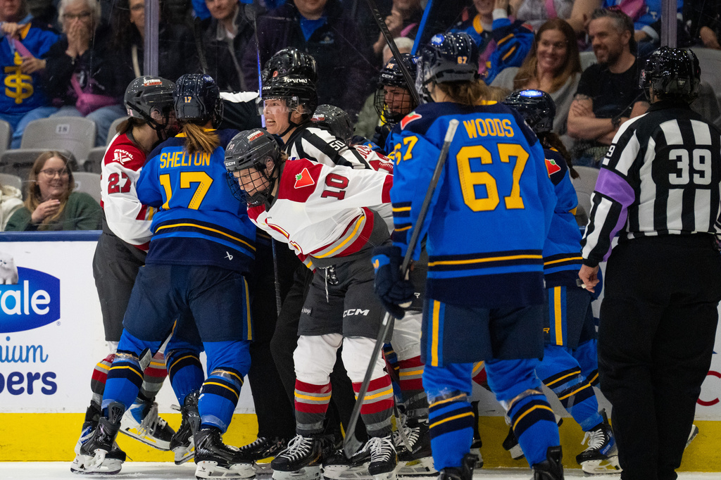 A fight breaks out between the Toronto Sceptres and the Ottawa Charge after the third period during PWHL hockey game action in Toronto, Saturday, April 11, 2026. (Arlyn McAdorey/The Canadian Press via AP)
