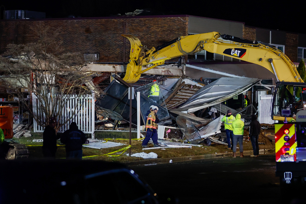 First responders work at the scene of an explosion and fire at Bristol Health & Rehab Center, Tuesday, Dec. 23, 2025, in Bristol, Pa. (Monica Herndon/The Philadelphia Inquirer via AP)