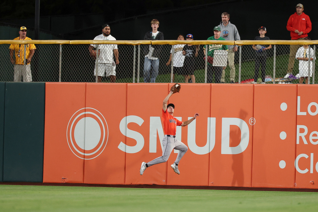 People watch as Houston Astros center fielder Lucas Spence catches a fly ball hit by Athletics' Tommy White during the fourth inning of a baseball game Friday, Sept. 25, 2026, in West Sacramento, Calif. (AP Photo/Sara Nevis)