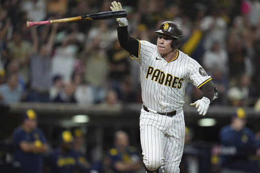 San Diego Padres' Freddy Fermin celebrates after hitting a walk off RBI single to defeat the Milwaukee Brewers during the eleventh inning of a baseball game Monday, Sept. 22, 2025, in San Diego. (AP Photo/Gregory Bull) San Diego Padres' Freddy Fermin celebrates after hitting a walk off RBI single to defeat the Milwaukee Brewers during the eleventh inning of a baseball game Monday, Sept. 22, 2025, in San Diego. (AP Photo/Gregory Bull)