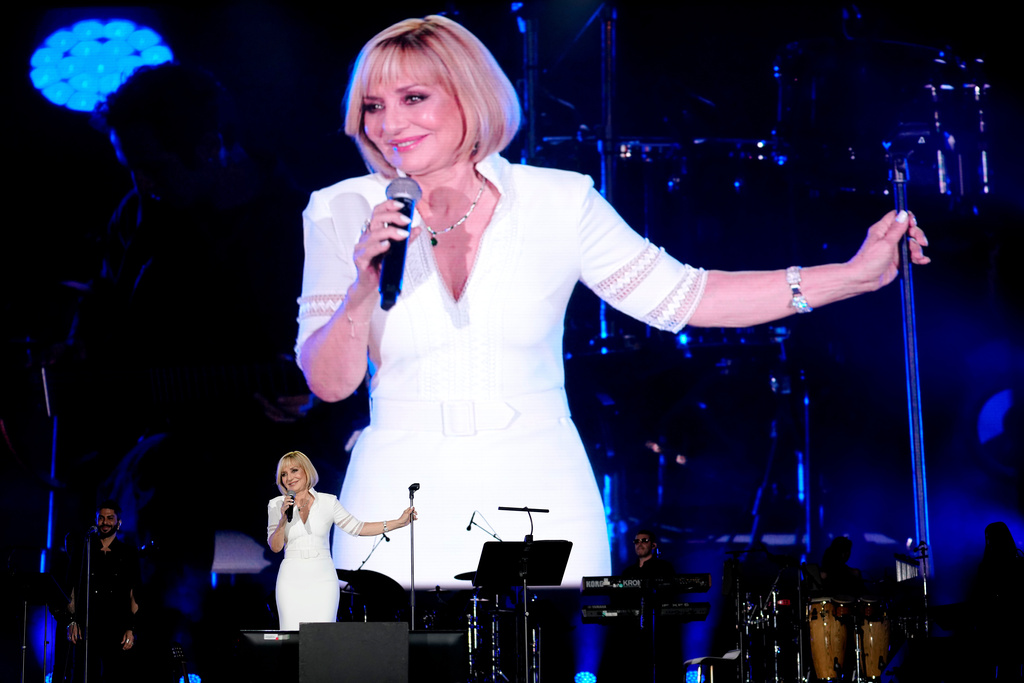 FILE - Iranian pop star Googoosh performs during a concert at the Dubai Expo 2020, in Dubai, United Arab Emirates, March 17, 2022. (AP Photo/Ebrahim Noroozi, File)