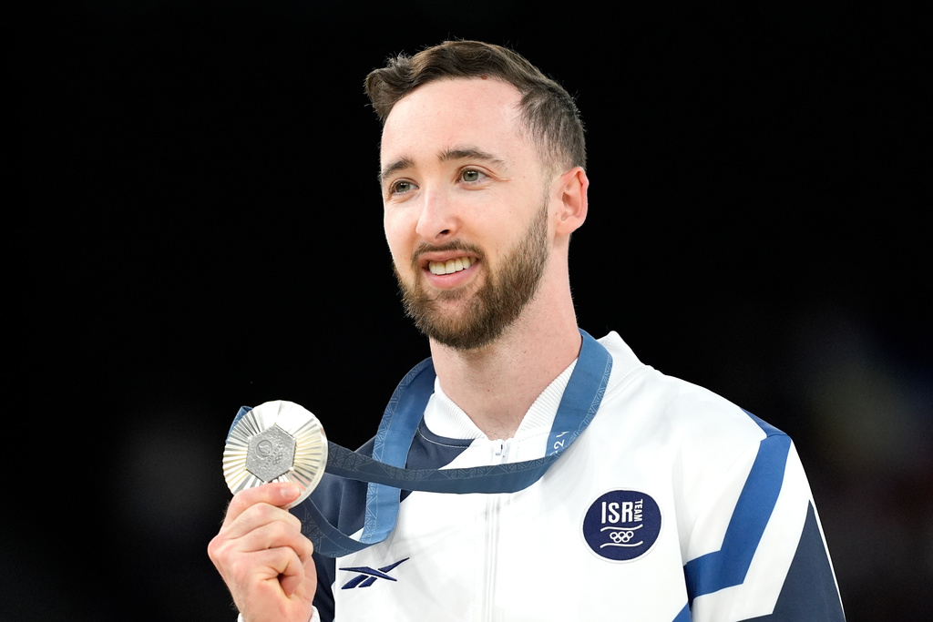 FILE - Artem Dolgopyat of Israel celebrates after winning the silver medal during the men's artistic gymnastics individual floor finals at Bercy Arena at the 2024 Summer Olympics, Saturday, Aug. 3, 2024, in Paris, France. (AP Photo/Francisco Seco, File)