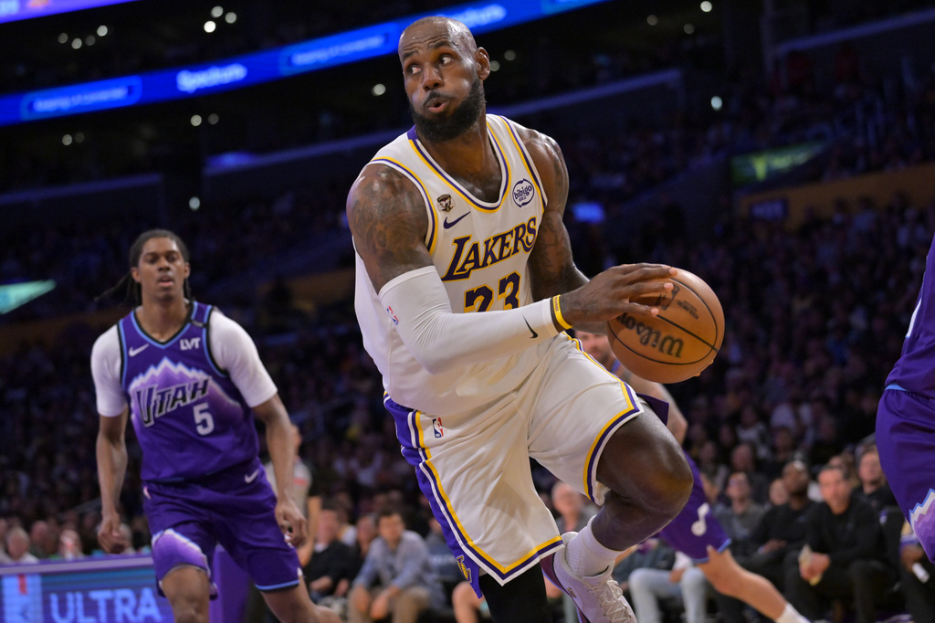 Los Angeles Lakers forward LeBron James looks to make a pass during the first half of an NBA basketball game against the Utah Jazz, Sunday, April 12, 2026, in Los Angeles. (AP Photo/Jayne Kamin-Oncea)