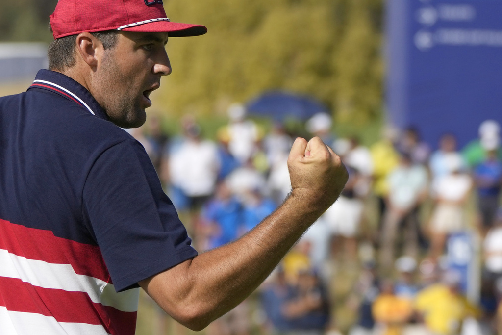 FILE - United States' Scottie Scheffler celebrates after putting on the 14th green during his singles match at the Ryder Cup golf tournament at the Marco Simone Golf Club in Guidonia Montecelio, Italy, Sunday, Oct. 1, 2023. (AP Photo/Alessandra Tarantino)