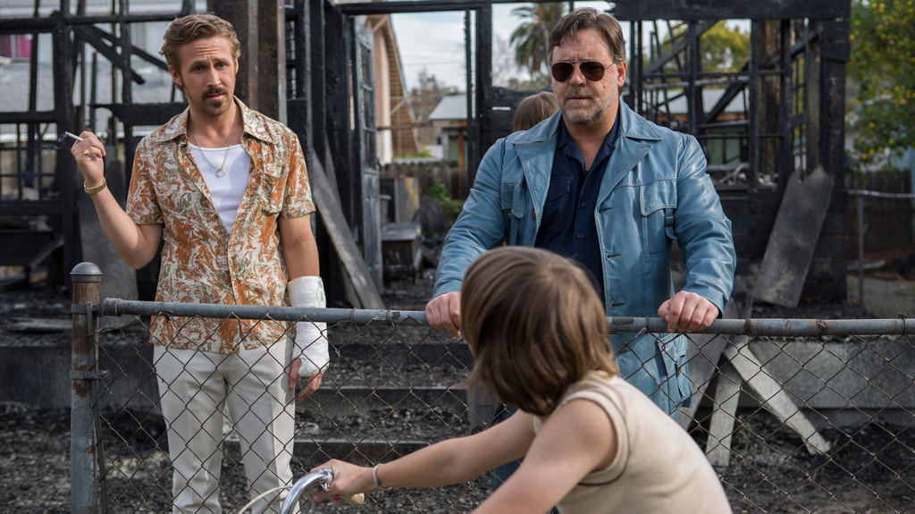 This image released by Warner Bros. shows Ryan Gosling, left, and Russell Crowe in a scene from "The Nice Guys." (Daniel McFadden/Warner Bros. via AP)