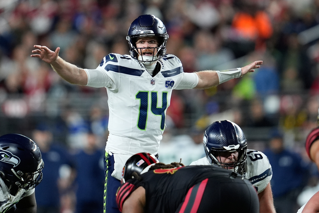Seattle Seahawks quarterback Sam Darnold (14) signals at the line of scrimmage during the first half of an NFL football game against the San Francisco 49ers in Santa Clara, Calif., Saturday, Jan. 3, 2026. (AP Photo/Godofredo A. V&aacute;squez)