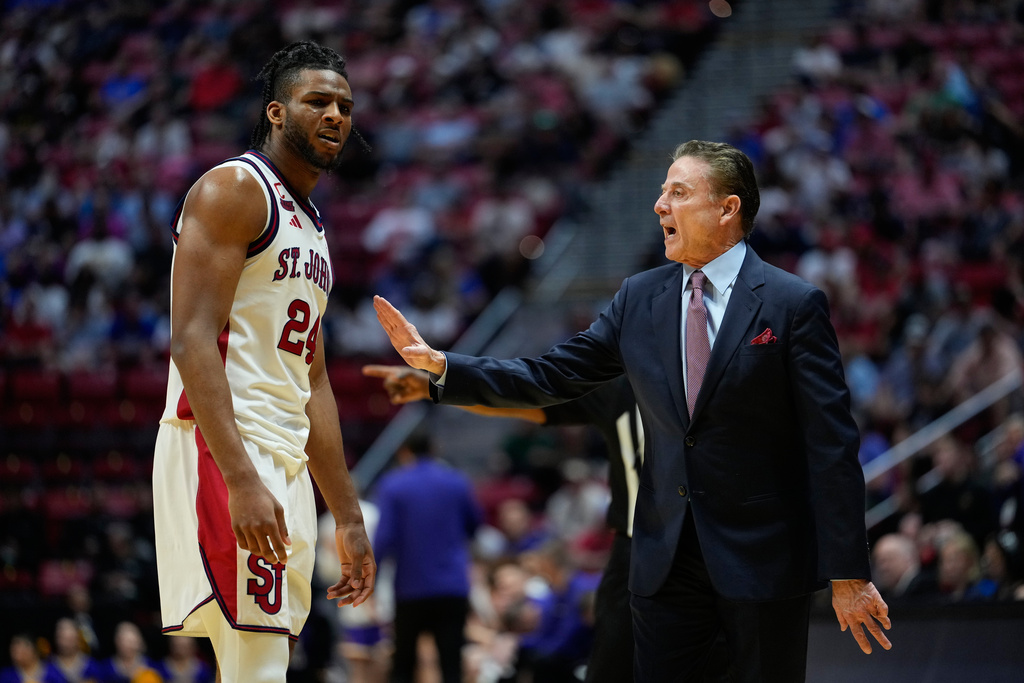 St. John's head coach Rick Pitino speaks with forward Zuby Ejiofor while playing Northern Iowa during the first half in the first round of the NCAA college basketball tournament Friday, March 20, 2026, in San Diego. (AP Photo/Mark J. Terrill)