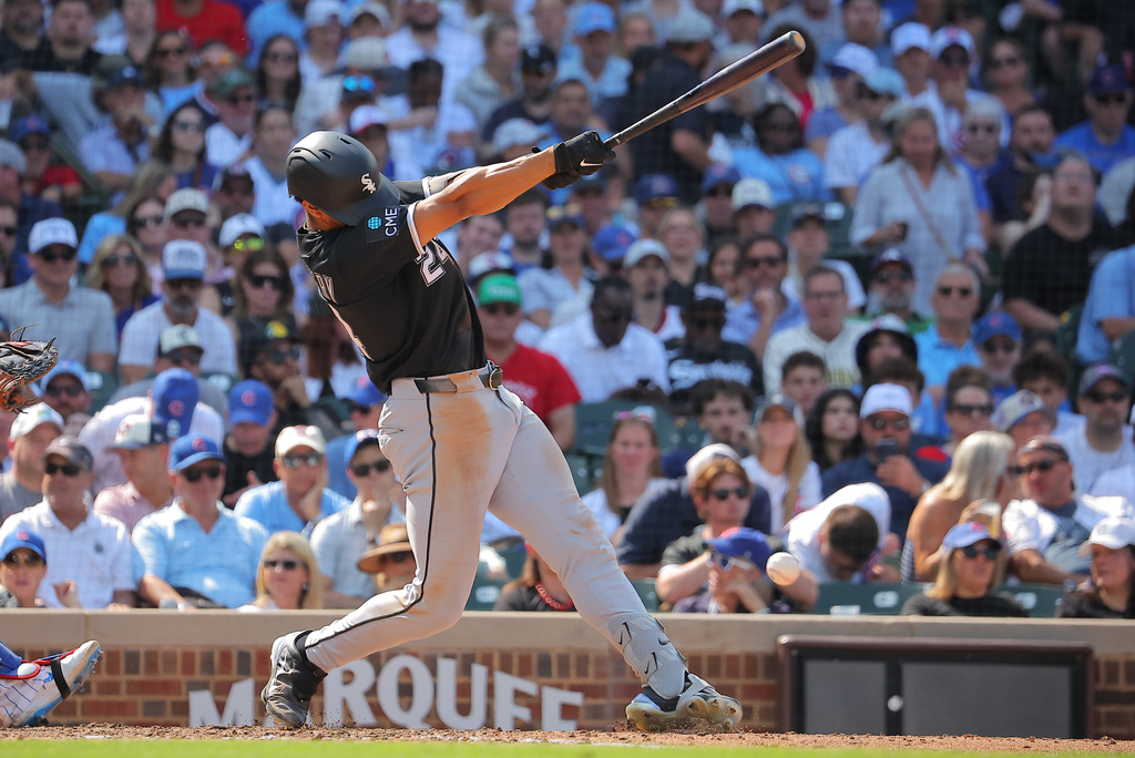 Chicago White Sox's Braden Montgomery hits a two-run double during the eighth inning of a baseball game against the Chicago Cubs, Wednesday, Aug. 19, 2026, in Chicago. (AP Photo/Melissa Tamez)