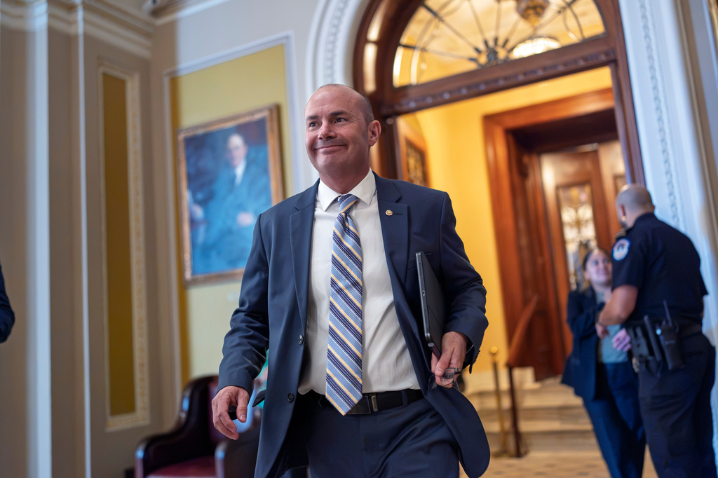 Sen. Mike Lee, R-Utah, chairman of the Energy and Natural Resources Committee, smiles as he heads to a closed-door luncheon with fellow Republicans, at the Capitol in Washington, Wednesday, Sept. 30, 2026. (AP Photo/J. Scott Applewhite)