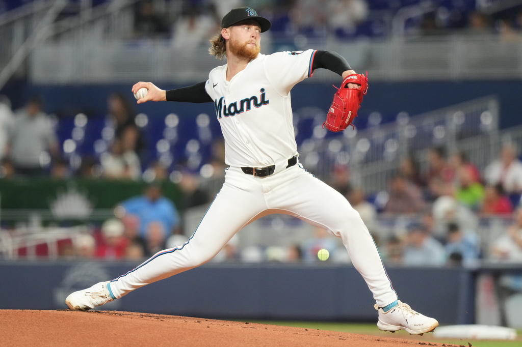 Miami Marlins starting pitcher Max Meyer aims a pitch during the first inning of a baseball game against the Cincinnati Reds Thursday, April 9, 2026, in Miami. (AP Photo/Marta Lavandier)