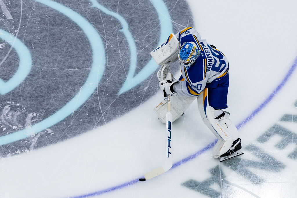 St. Louis Blues goaltender Jordan Binnington warms up before an NHL hockey game against the Seattle Kraken, Wednesday, March 4, 2026, in Seattle. (AP Photo/Maddy Grassy)