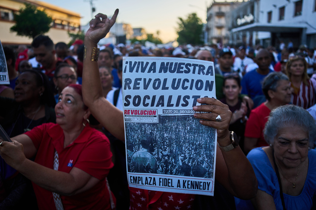People attend a celebration marking the 65th anniversary of the proclamation declaring the Cuban Revolution socialist, in Havana, Cuba, Thursday, April 16, 2026. (AP Photo/Ramon Espinosa)