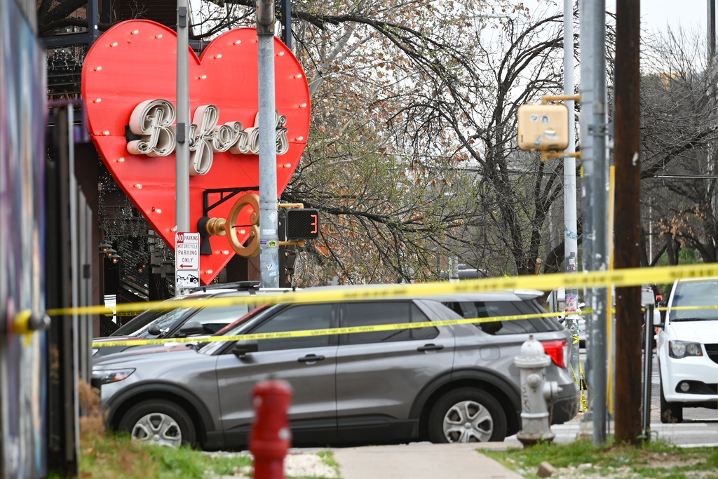 The Austin Police Department and the FBI investigate a shooting at Buford's on 6th Street on Sunday, March 1, 2026, in Austin, Texas. (AP Photo/Jack Myer)
