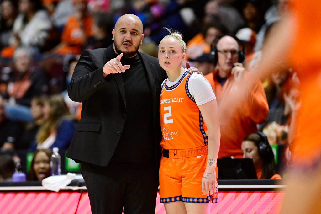 Connecticut Sun head coach Rachid Meziane talks with Connecticut Sun guard Hailey Van Lith in the first half of a WNBA basketball game against the Toronto Tempo, Thursday, Sept. 24, 2026, in Uncasville, Conn. (AP Photo/Jessica Hill)