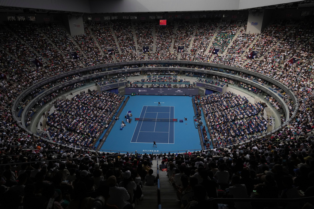 Jannik Sinner of Italy and Learner Tien of the United States play in the men's singles final match to a packed Diamond Court during the China Open tennis tournament in Beijing on Wednesday, Oct. 1, 2025. (AP Photo/Andy Wong)