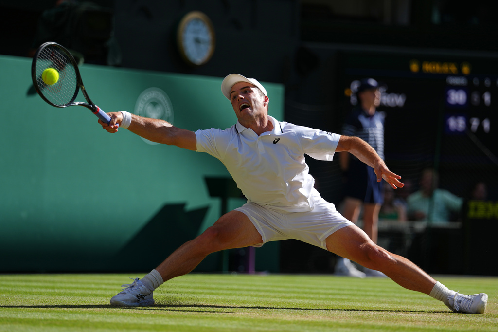 Arthur Fery of Britain plays a return during the men's singles fourth round match against Grigor Dimitrov of Bulgaria at the Wimbledon Tennis Championships in London, Monday, July 6, 2026.(AP Photo/Kirsty Wigglesworth)
