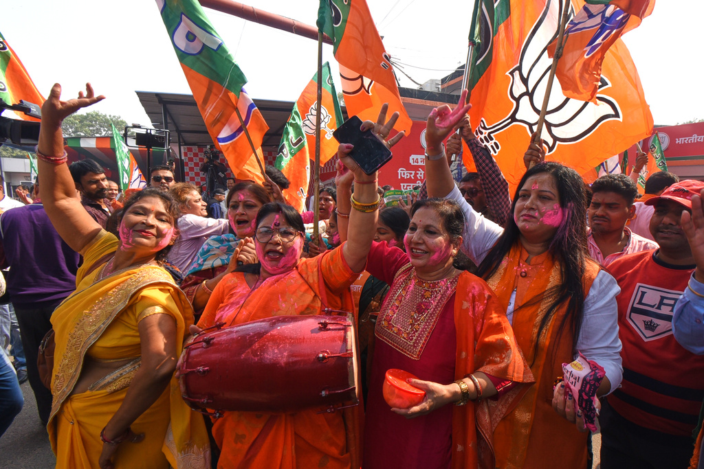 Women supporters of Bharaiya Janata party celebrate the early leads in Bihar state election results in Patna, India, Friday, Nov.14, 2025. (AP Photo)