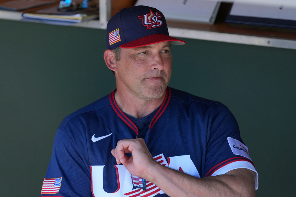 United States manager Mark DeRosa pauses in the team dugout prior to an exhibition baseball game against the San Francisco Giants Tuesday, March 3, 2026, in Scottsdale, Ariz. (AP Photo/Ross D. Franklin)
