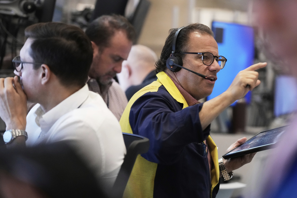 Options trader Anthony Spina, right, works on the floor of the New York Stock Exchange, Monday, Sept. 15, 2025. (AP Photo/Richard Drew)