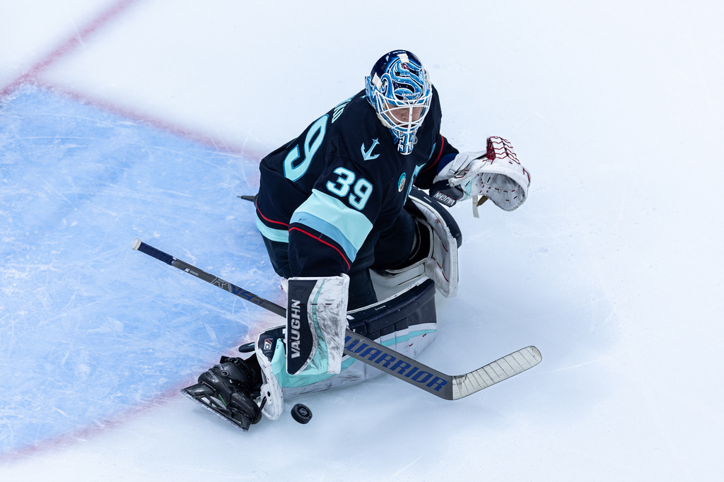 Seattle Kraken goaltender Nikke Kokko warms up before an NHL hockey game against the Calgary Flames, Saturday, April 11, 2026, in Seattle. (AP Photo/Maddy Grassy)