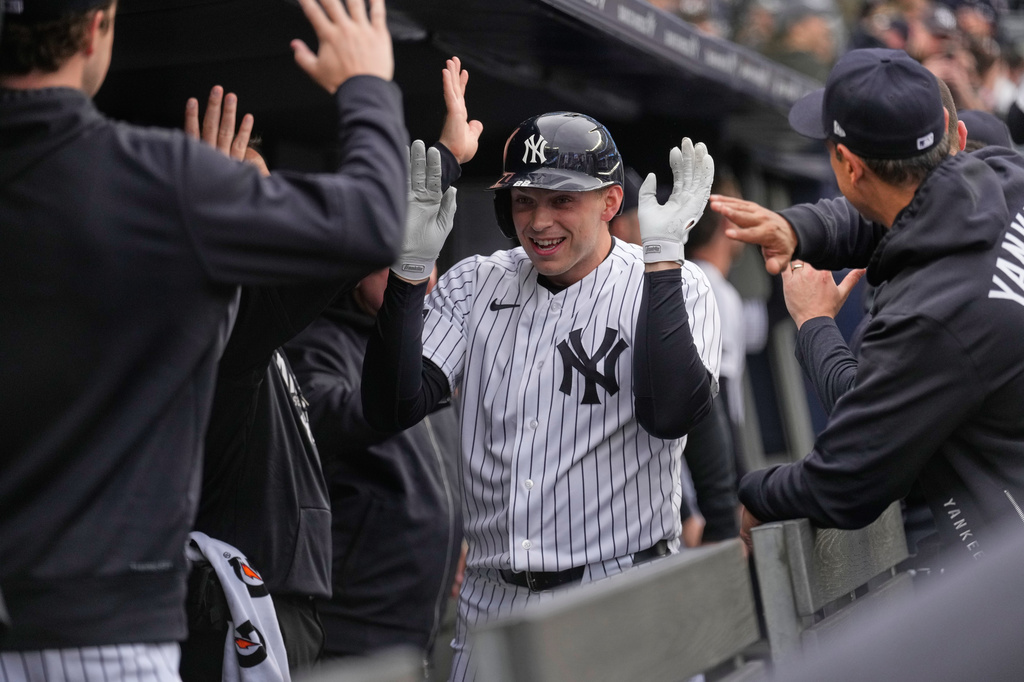 New York Yankees' Ben Rice celebrates his three-run home run in the dugout during the first inning of a baseball game against the Miami Marlins, Sunday, April 5, 2026, in New York. (AP Photo/Seth Wenig)
