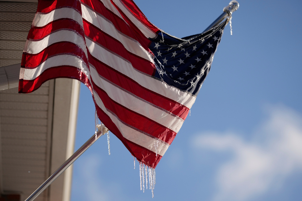 Icicles cling to an American flag in Nashville, Tenn., (AP Photo/George Walker IV)