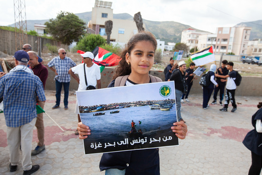 Demonstrators gather at a memorial site honoring the victims of the 1985 Israeli attack on Palestine Liberation Organization's headquarters, in Hammam Chott outside Tunisia's capital, Wednesday, Oct. 1, 2025. Banner in Arabic reads "From the sea of Tunisia to the sea of Gaza". (AP Photo/Ons Abid) Demonstrators gather at a memorial site honoring the victims of the 1985 Israeli attack on Palestine Liberation Organization's headquarters, in Hammam Chott outside Tunisia's capital, Wednesday, Oct. 1, 2025. Banner in Arabic reads "From the sea of Tunisia to the sea of Gaza". (AP Photo/Ons Abid)